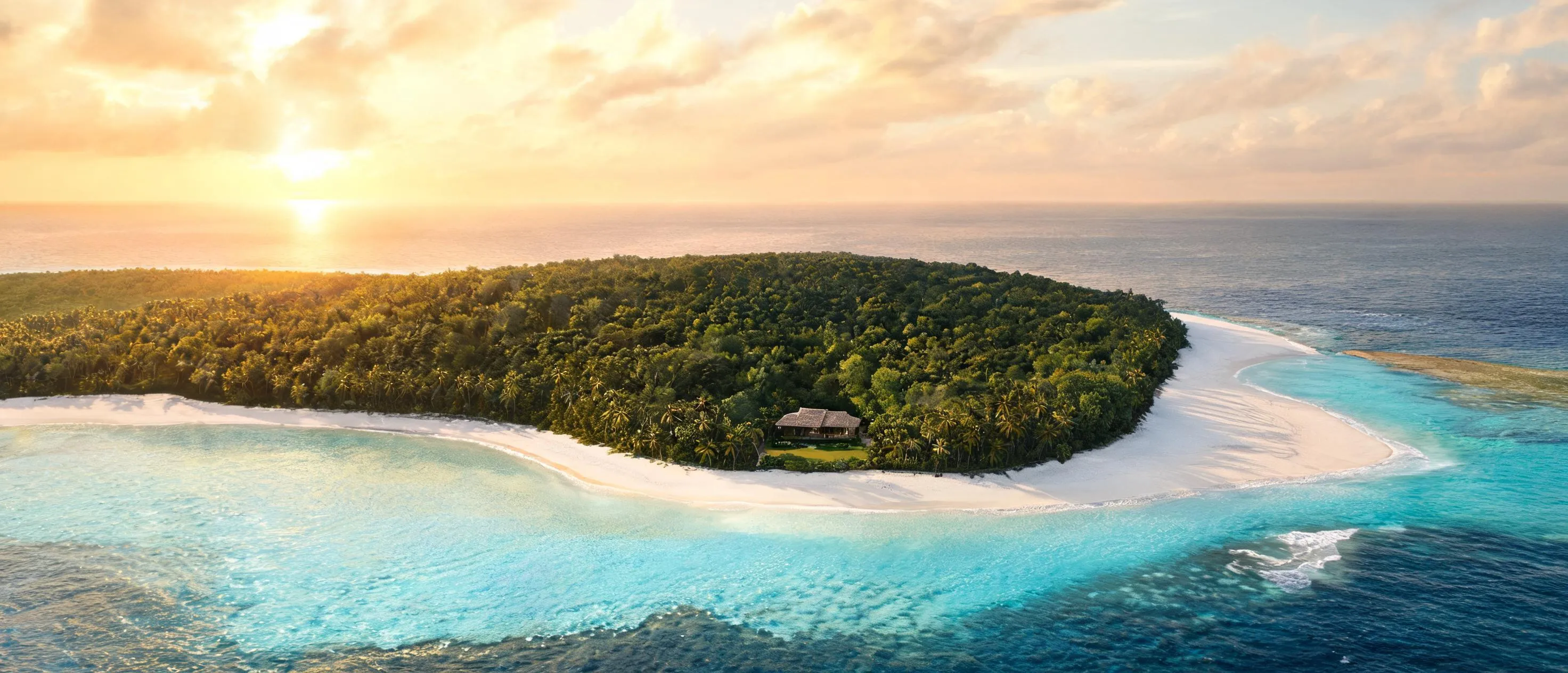 A private island at dusk, held in full for a single party